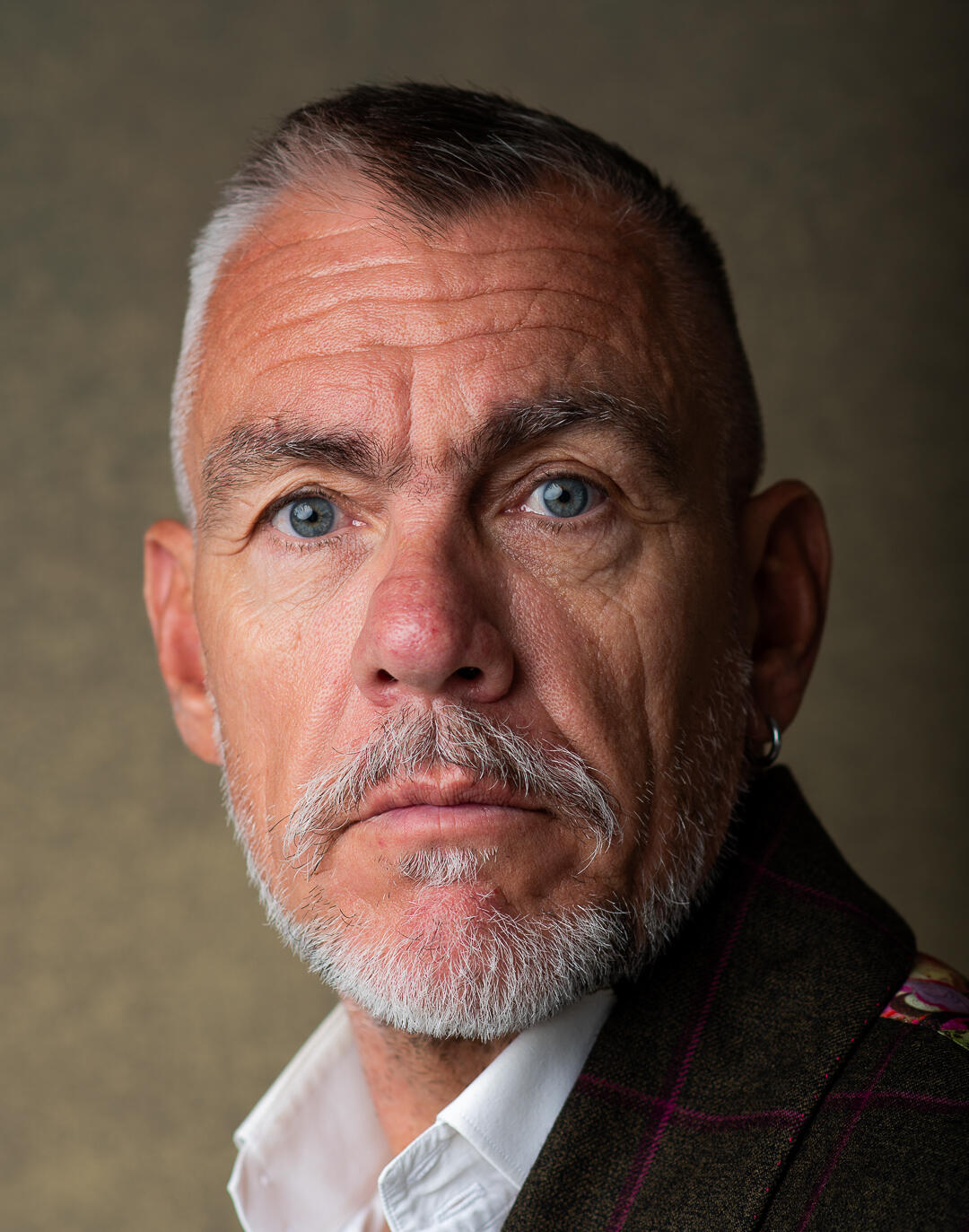 The picture shows a beautiful (if I do say so myself) headshot of a mature man.